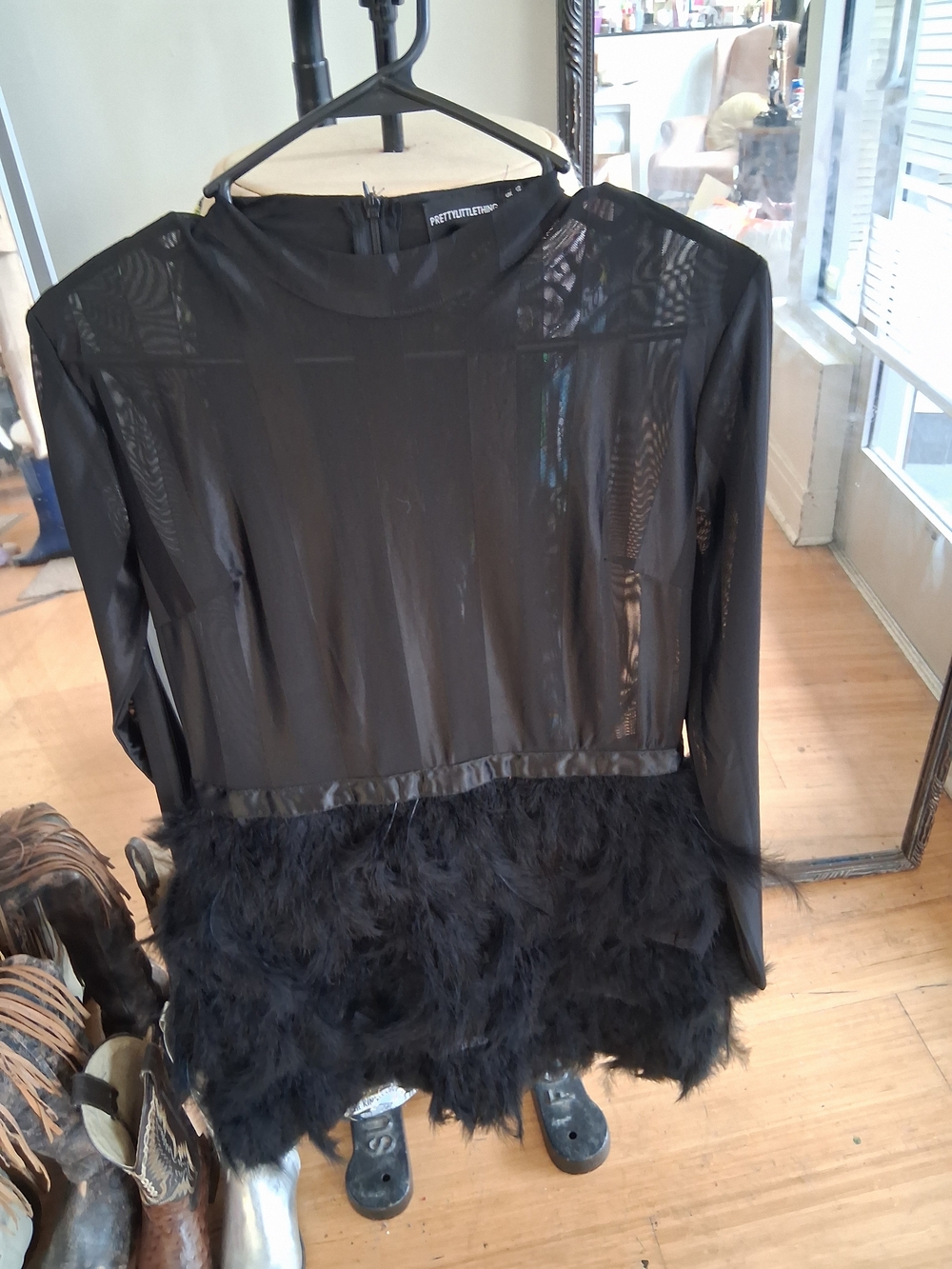 Sheer Black Long-Sleeve Top with Feathered Hem